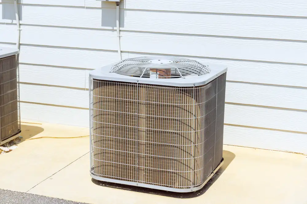 An air conditioner on a cement slab in Naples, Florida