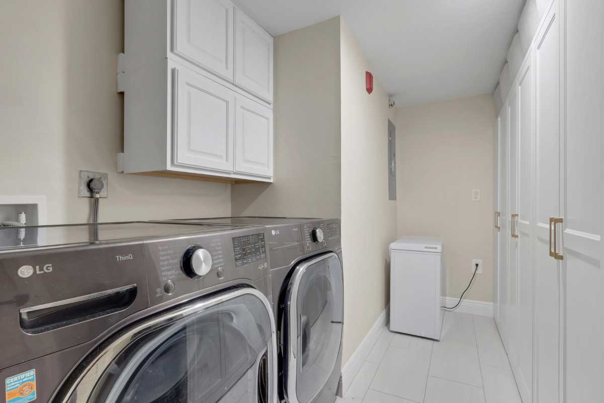 The laundry room at 3031 Sandpiper Bay Circle #F106 listed on the MLS for sale